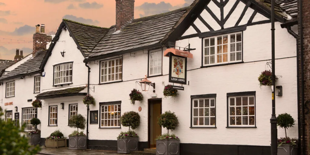 The front of the Legh Arms pub and hotel in Prestbury close to Macclesfield and Manchester